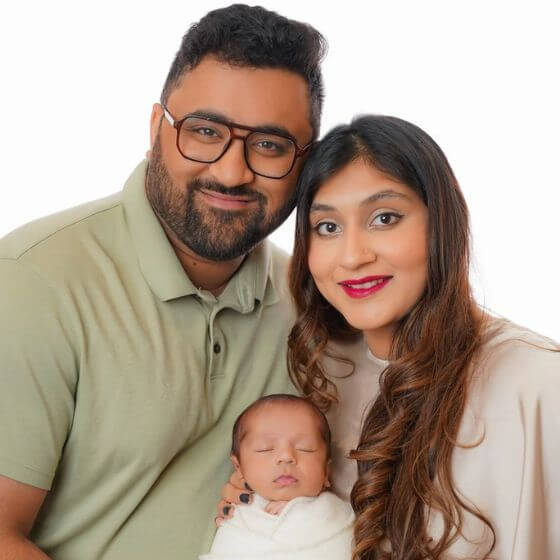 Parents holding their infant